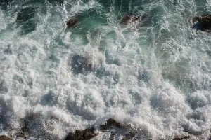 Swell Prints: Ocean wave background breaking sea water rocky shore rough seas turquoise water gradient foam