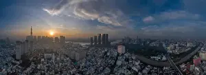 Waking Prints: Five o'clock, early morning aerial urban panorama of Ho Chi Minh City featuring city center