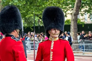 Military Uniform Prints: An officer of The Welsh Guards with a Guardsman standing on street lining duty along the Mall at The Trooping The