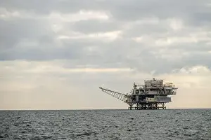 Shimmering Prints: Oil Rig Rises Over The Water Along California Coast in the Santa Barbara Channel