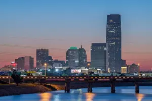 Oklahoma City, Oklahoma, USA downtown skyline on the Oklahoma River at dusk