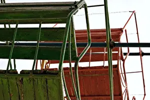 Rusty Prints: Old abandoned Ferris wheel wooden cabins close up detail