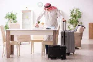 Preparing Prints: Old arab businessman preparaing for the business trip