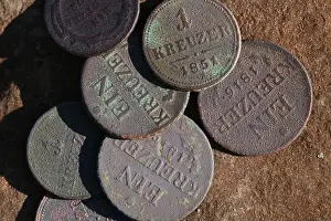 Finding Prints: Old Austro-Hungarian coins on wooden table