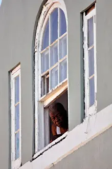 Sticking Prints: Old black man looking out of the window, Nassau, Bahamas