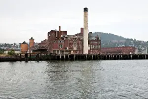 Piles Prints: old brick buildings of Georgia Pacific abandoned paper mill on waterfront in Bellingham Washington have a sombre aspect