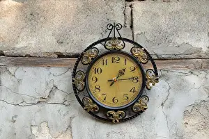 Timer Prints: old broken clock ussr hangs on the white wall of a house in the street in the sun