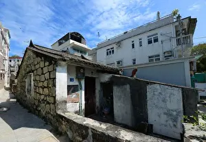 Old Village Prints: An old building in Tai Peng old village on Lamma island in Hong Kong