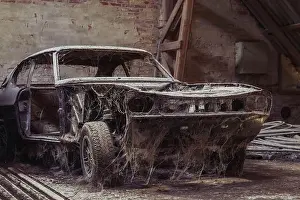 Dump Prints: Old disassembled car in an abandoned factory