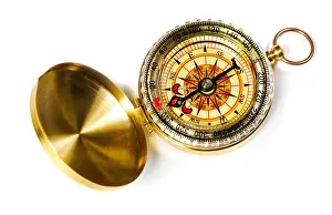 Compass Prints: old-fashioned magnetic compass over white background