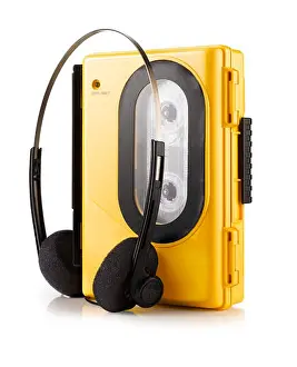 Magnetic Prints: An old fashioned yellow portable Walkman style cassette player with headphones