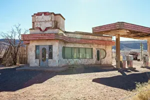 Gas Station Prints: Old gas station in Sahara desert near Ouarzazate, Morocco. Toned image