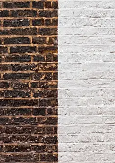 White Surface Prints: Old grunge brick texture background with new bricks mixed in half