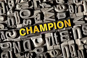 Dyed Prints: Old lead letters forming the word champion