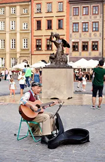 Street Performer Prints: Old man singer gig playing guitar in Old Town Market Place square in Warsaw