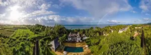 Inflatable Prints: old plantation house with swimming pool and beach chairs by the ocean