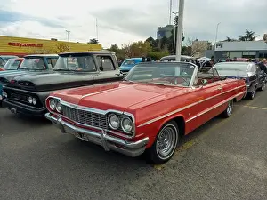 Convertible Prints: Old red 1964 Chevrolet Chevy Impala SS Super Sport V8 two-door convertible by GM in a parking lot