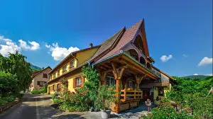 Old but renovated village house in countryside aerial view, Alsace, France