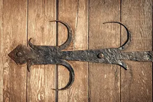 Knob Prints: old rusty decorative element and wood door. Background for design