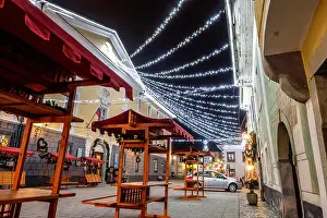 Gorenjska Prints: Old town square with Christmas decorations and empy stalls for the Christmas fair