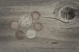Cent Prints: Old United States coins on rustic wood with vintage concept. Layout in horizontal format