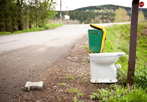 Dump Prints: Old used toilette roadside garbage thrown away