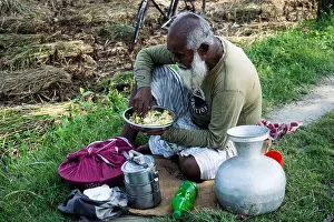 Old Man Prints: old village farmer is eating lunch next to the agricultural land