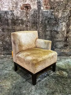 Adversity Prints: Old vintage armchair in an abandoned building