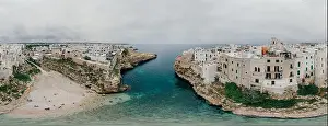 Old white city near blue the Sea Polignano Apulia Coastline blue in Italy Drone 360 vr