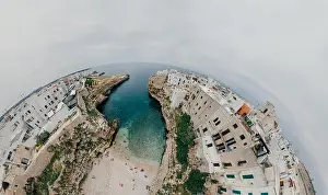 Alberobello Prints: Old white city near blue the Sea Polignano Apulia Coastline blue in Italy Drone 360 vr