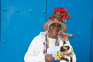 Cigar Prints: Old woman posing for photos with cigar and cat Old Havana Cuba
