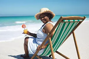 Deckchair Prints: Old woman relaxing at the beach