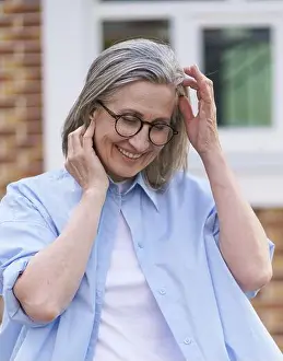 Spectacles Prints: An older woman wearing glasses and a blue shirt