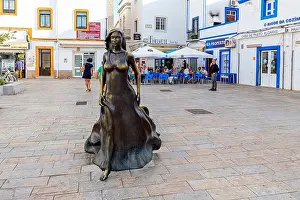 Algarve Prints: The Olhao statue of Floripes, a legendary moorish woman who wanders every night trying to seduce fishermen