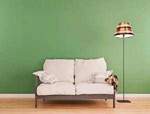 Portfolio Prints: Olive green mock-up wall with small white sofa and floor lamp in modern interior background