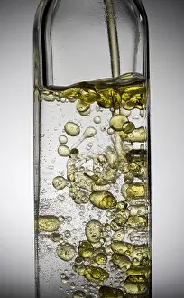 Droplets Prints: Olive oil droplets in bottle of water