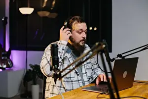 Podcast Prints: An online blogger speaks into a microphone during a stream