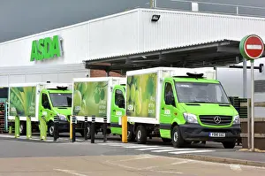Online home delivery Asda trucks queue outside the Asda supermarket in Wheatley