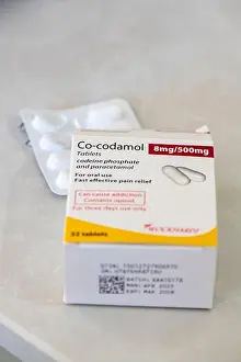 Tablets Prints: opened box of co-codamol painkillers with blister pack of tablets or pill's part used