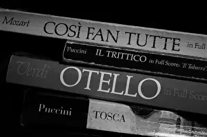 Orchestra Prints: opera musical scores, books stacked, black and white