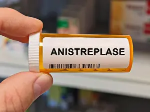 Tablets Prints: orange plastic Box of ANISTREPLASE tablets on a hospital pharmacy table used to dissolve blood clots a thrombolytic
