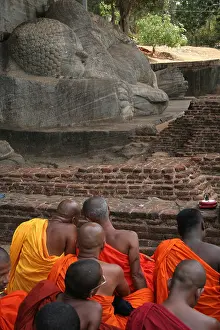 Reclining Prints: Orange robe clad monks at a gathering