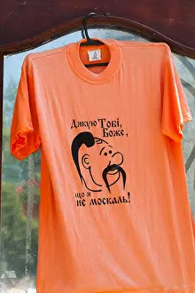 Ukrainian Prints: Orange t-shirt with slogan 'Thank God I am not a moskal', Lviv, Ukraine