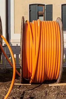 Coil Prints: Orange Telephone Cable On A Large Wooden Reel, Data Cable Being Laid Underground
