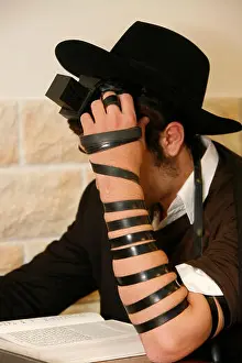 Practicing Prints: Orthodox Jew reading a prayer book and wearing phylactery