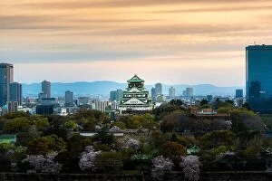 Images Dated 10th April 2017: Osaka castle with cherry blossom and Center business district in background at Osaka, Japan