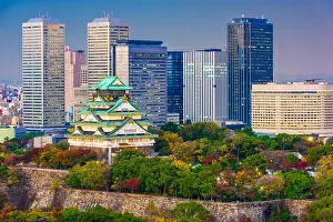 Osaka, Japan city skyline at the castle and business park at dusk in autumn