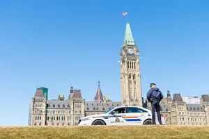 Prevent Prints: Ottawa, Canada - 15th April 2016: A RCMP police car is parked in front ot the Canadian Parliament in Ottawa