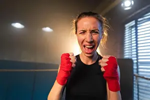 Boxer Prints: Outcry independent girl power. Angry strong crazy woman fighter screaming looking aggressive on boxing ring