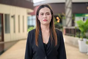 Real Life Prints: Outdoor portrait of a confident Thai businesswoman in a black blazer